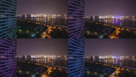 夜晚照明海南岛三亚湾公寓综合体全景4k时间推移的中国高清在线视频素材下载