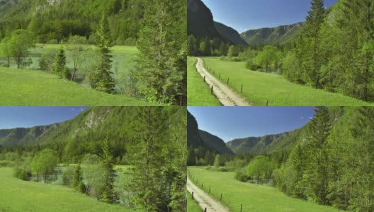 WS空中土路周围是绿色的牧场高清在线视频素材下载