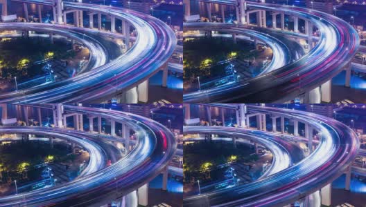 skyline and busy traffic on elevated road intersection at night, time lapse.高清在线视频素材下载