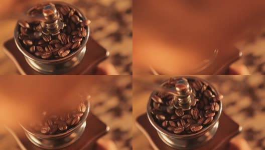 Vintage manual coffee grinder with coffee beans on wood table高清在线视频素材下载