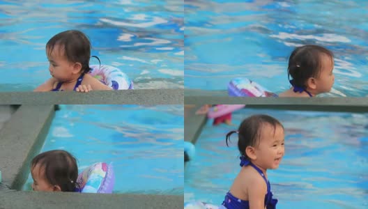 小女孩在游泳池里游泳。高清在线视频素材下载