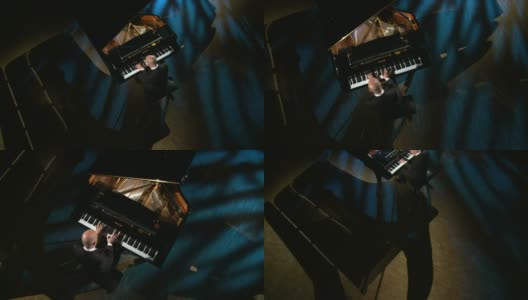 高清起重机:钢琴家在音乐厅演奏高清在线视频素材下载
