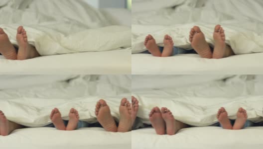 躺在床上的家人和他们的脚高清在线视频素材下载