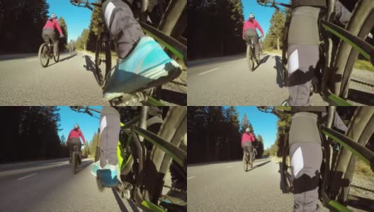 骑自行车的人沿着乡间小路骑车高清在线视频素材下载
