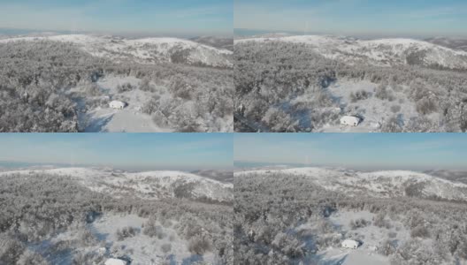 冬天的森林在雪地里被阳光的光芒照亮高清在线视频素材下载