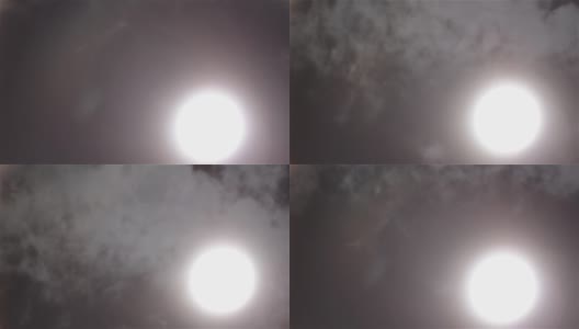 白云和薄雾在白色的太阳面前掠过高清在线视频素材下载