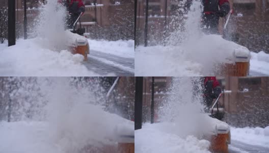 模糊扫雪机在冬季在大雪天气背景下清除道路上的积雪。高清在线视频素材下载