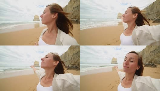 年轻女子的双臂伸展在吉布森海滩，澳大利亚高清在线视频素材下载