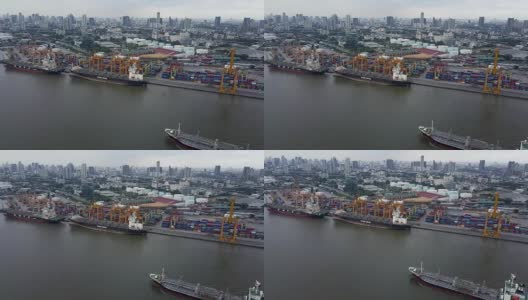 航拍曼谷商业港口的集装箱沿饶普拉雅河，泰国曼谷。高清在线视频素材下载