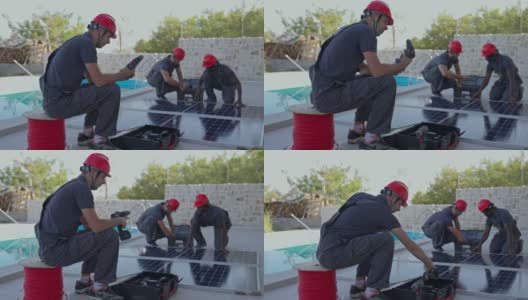 由多种族男性蓝领工人和安装太阳能电池板的工程师组成的团队高清在线视频素材下载