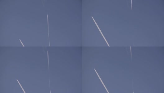 两架喷气式飞机在蓝天上飞行，身后留下白色的条纹高清在线视频素材下载