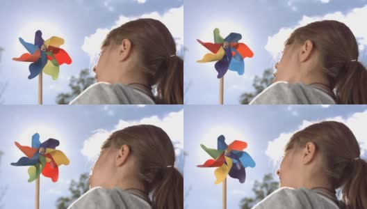高清超级慢动作:小女孩玩风车高清在线视频素材下载
