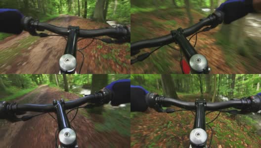 山地自行车穿过绿色森林TL POV高清在线视频素材下载