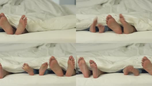 躺在床上的家人和他们的脚高清在线视频素材下载