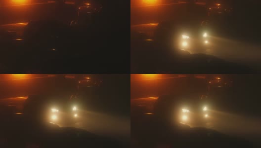 夜晚浓雾中的车灯打开了高清在线视频素材下载