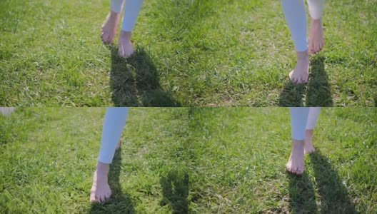 夏天，一个女人光着脚在绿草地上行走的特写高清在线视频素材下载