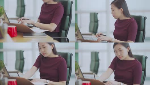 亚洲中国美女在办公室用笔记本电脑打字高清在线视频素材下载