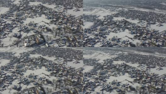 在寒冷的雪天，航拍的东欧西部乌克兰伊万诺弗兰基夫斯克市郊区居民区。无人机从空中拍摄的Sityscape，背景是河流。高清在线视频素材下载