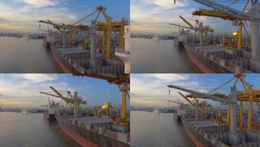 日落时分工业港口集装箱船鸟瞰图高清在线视频素材下载