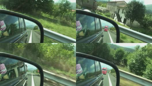 从侧面的后视镜拍摄的高速公路高清在线视频素材下载
