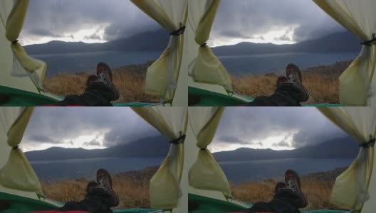 在Nemrut火山口湖附近的一个帐篷里的慢镜头，有风，有云，有雨高清在线视频素材下载