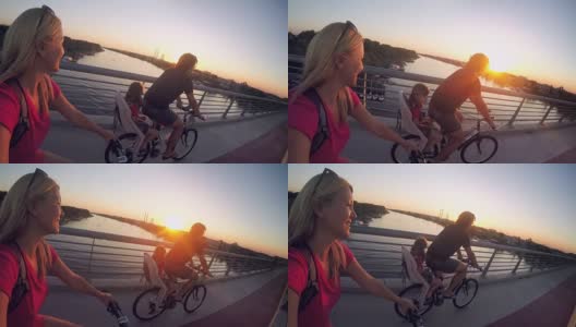 日落时分，一家人在城市里一起骑车高清在线视频素材下载