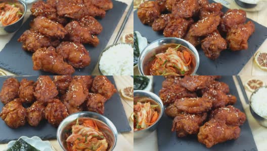 韩式炸鸡配辣酱传统的韩式食物，炸鸡配米饭和泡菜放在木桌上。高清在线视频素材下载