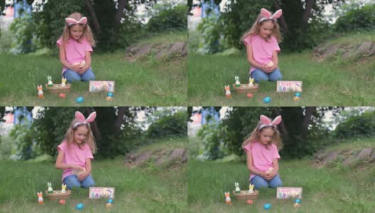 在复活节户外，女孩手捧小鸡高清在线视频素材下载