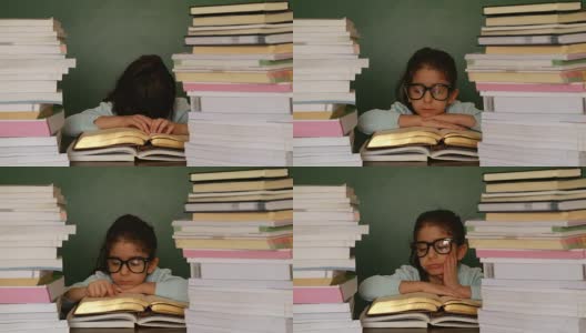 可爱的女孩在学校读书高清在线视频素材下载