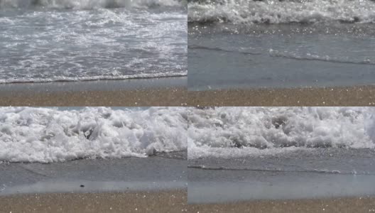波浪在沙滩上汹涌而过，白色的泡沫填满了屏幕，然后以慢镜头的方式退去又退去高清在线视频素材下载