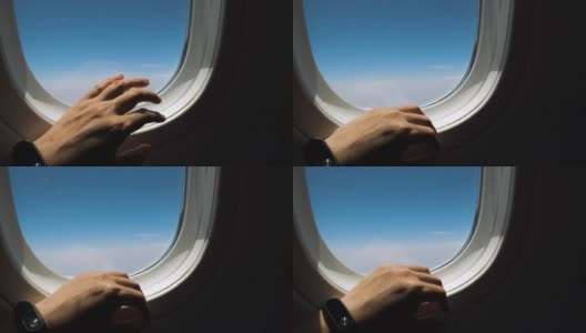 靠近手做手指敲窗户，恐惧的情绪的飞机飞行高清在线视频素材下载