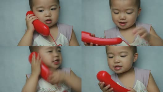 宝宝对着电话喇叭呀呀学语高清在线视频素材下载