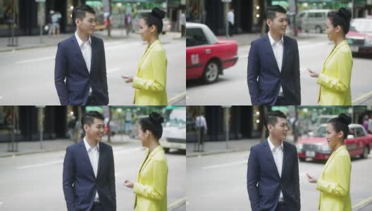亚洲商人在街上说话高清在线视频素材下载