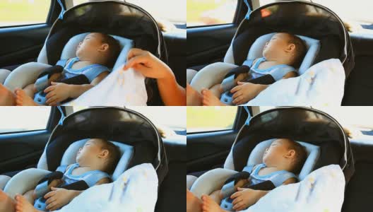 高清:一个小男孩在车里睡觉的照片。高清在线视频素材下载