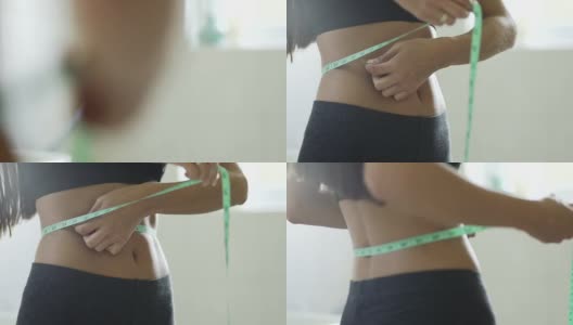 用英寸来测量一个美丽的身体的腰围高清在线视频素材下载