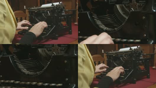 一个女人在给一台很旧的打字机写信高清在线视频素材下载