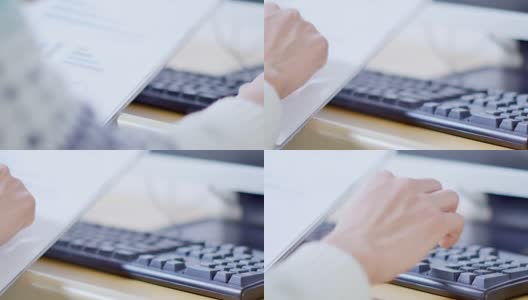 男人的手拿着财务报告，触摸着电脑键盘高清在线视频素材下载