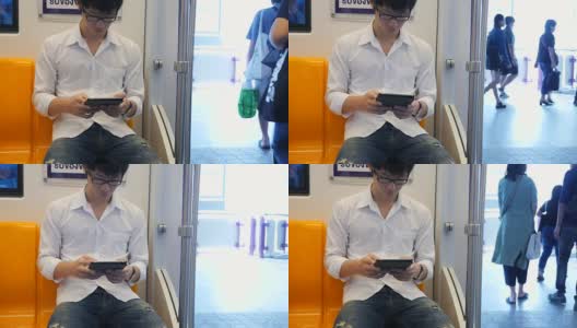 年轻人在火车上使用平板电脑高清在线视频素材下载