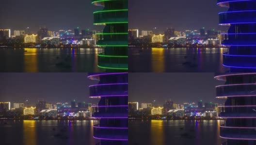 夜间照明三亚湾著名的酒店综合体侧屋顶全景，4k时间推移海南岛中国高清在线视频素材下载