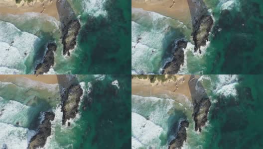 澳大利亚新南威尔士州Narooma海滩上的Glasshouse Rocks上的无人机照片高清在线视频素材下载