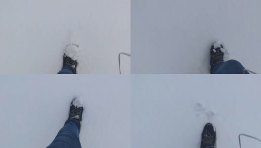 在雪地里行走。女人在大自然的冬季深雪中徒步旅行。雪天雪地里一个人的脚印。高清在线视频素材下载