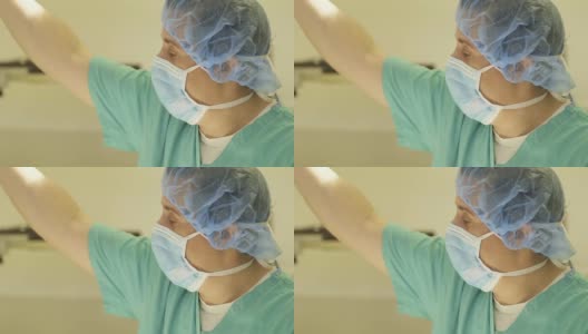外科医生用灯照亮手术台高清在线视频素材下载