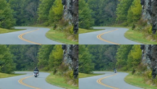 骑着摩托车的游客在北卡罗来纳州的蓝岭公园路上高清在线视频素材下载