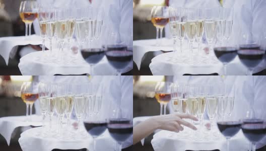 服务员用酒精饮料迎接客人。有香槟，红酒，白葡萄酒。高清在线视频素材下载