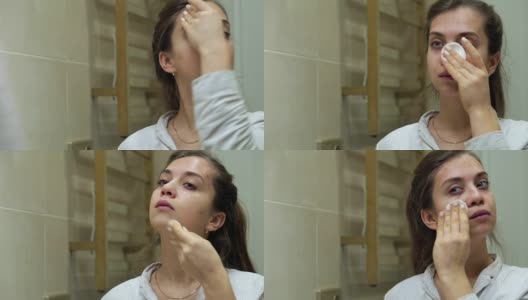 年轻迷人的女子在洗脸高清在线视频素材下载