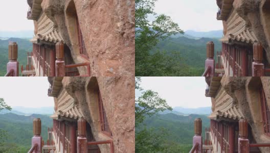 中国甘肃天水市麦积山石窟庙群廊道和阶梯。丝绸之路上一座有宗教洞穴的山高清在线视频素材下载