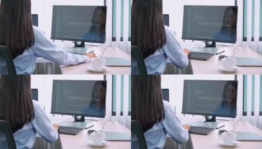 亚洲女程序员，在办公室用电脑输入源代码来开发程序或应用程序高清在线视频素材下载