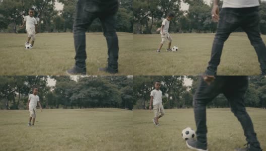 慢镜头:父亲和儿子在玩足球高清在线视频素材下载