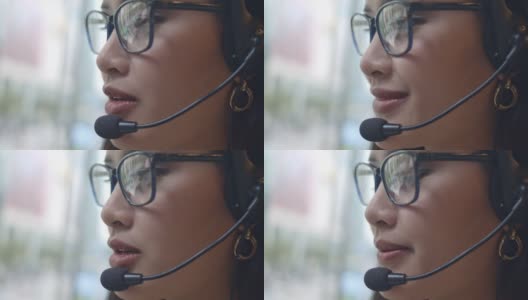 在呼叫中心工作的亚洲女性，特写高清在线视频素材下载