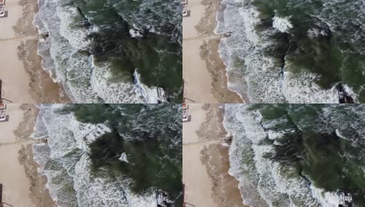 航拍无人机观察海浪翻滚到沙滩上的景象。高清在线视频素材下载